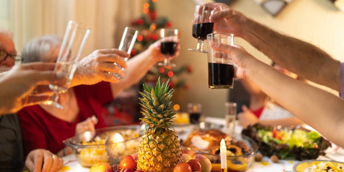 Family Having Dinner Together Celebrating Christmas Time